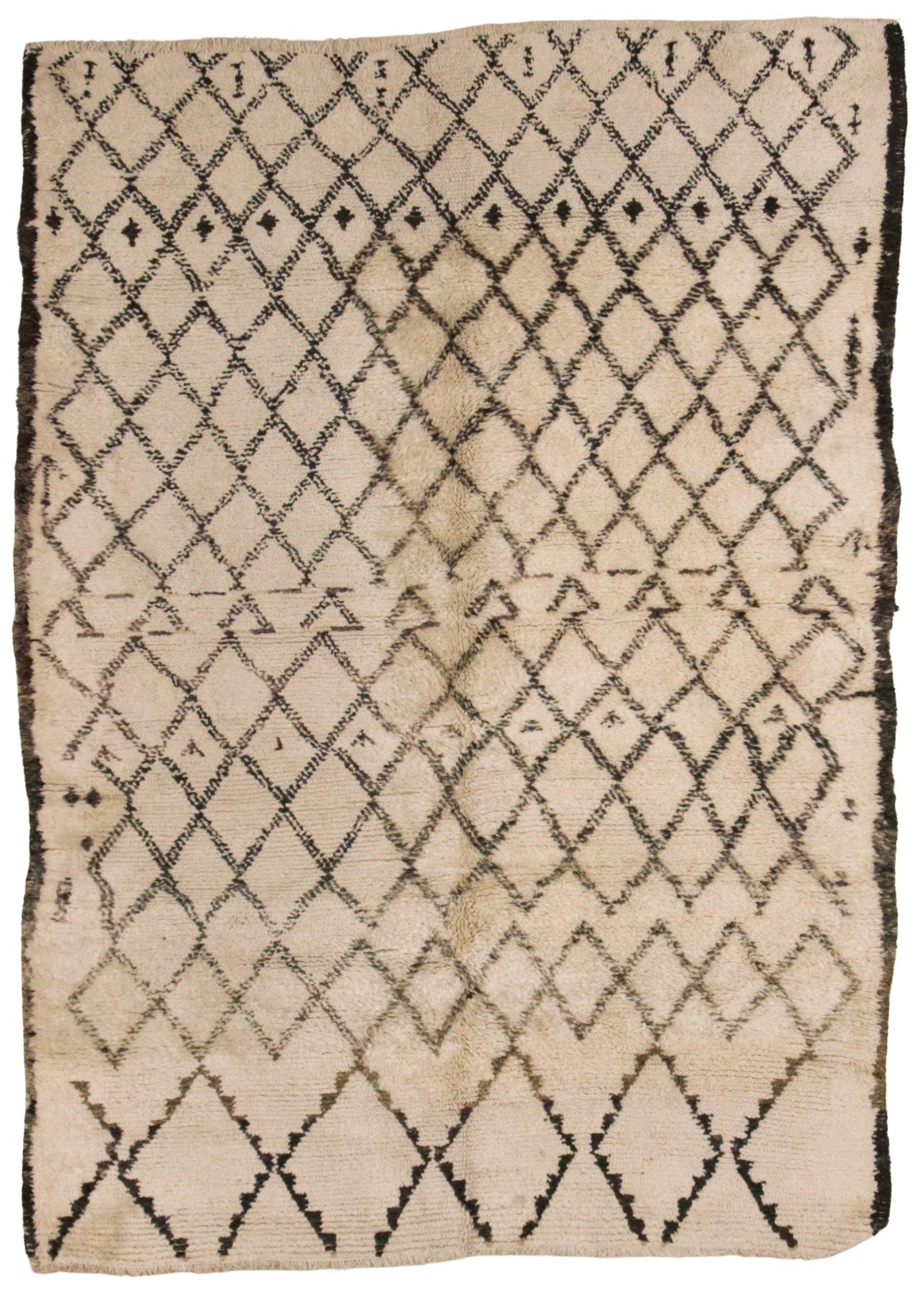 A square beige textile rug or mat with a black diamond lattice pattern and a dark fringe around the edges, photographed flat against a white background.