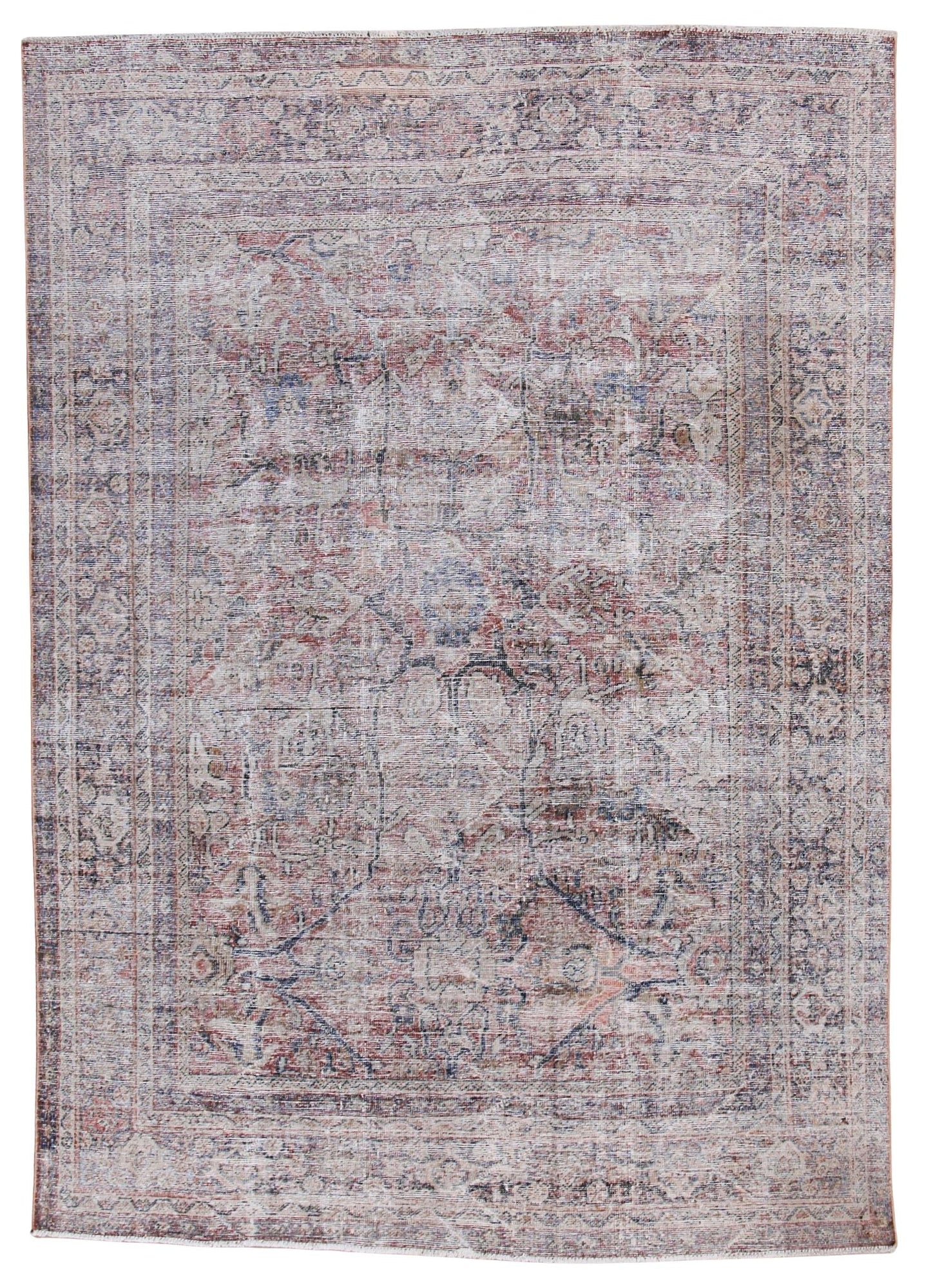 A distressed traditional oriental rug with an intricate floral and medallion pattern in faded dusty pink, beige, and muted blue-gray tones, shown flat against a white background.