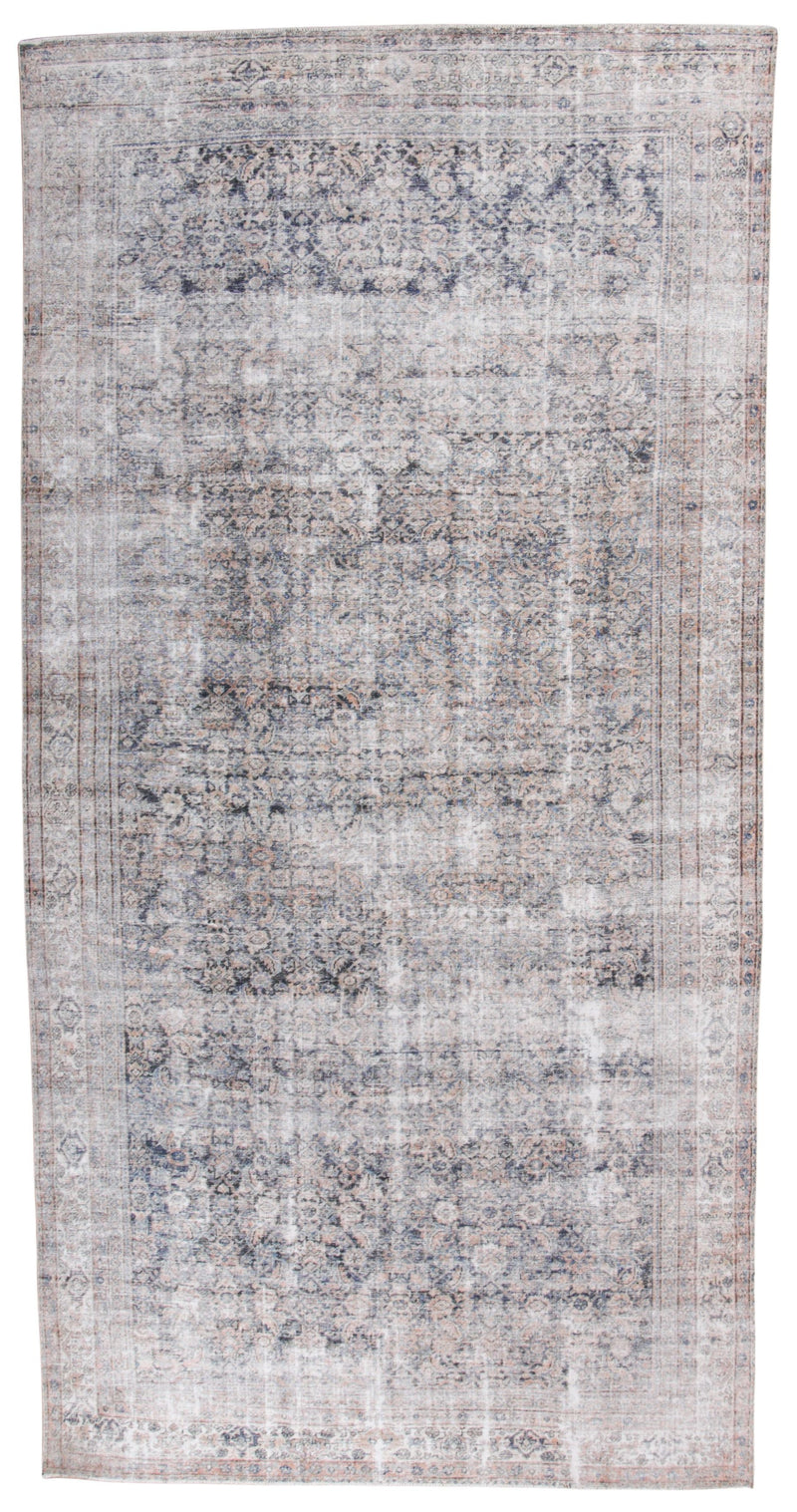 A rectangular distressed area rug with an intricate traditional pattern in faded shades of blue, gray, beige, and brown.