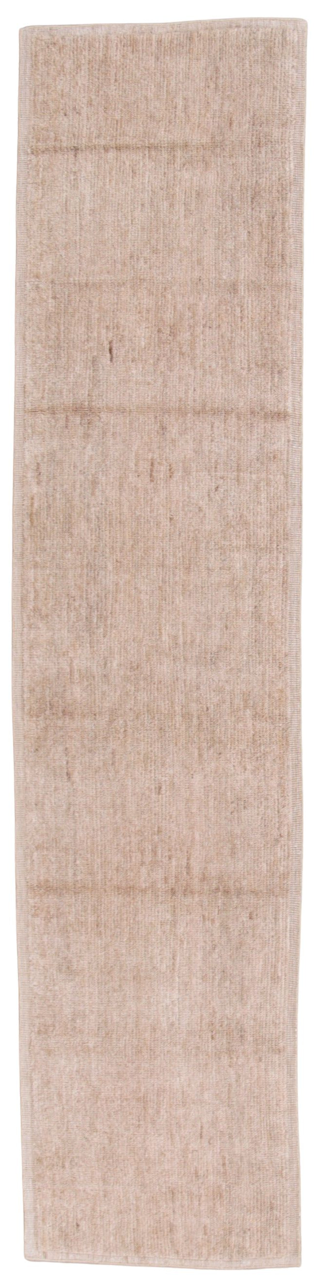 A rectangular area rug in a light beige or cream color with a subtle woven texture, shown flat against a white background.